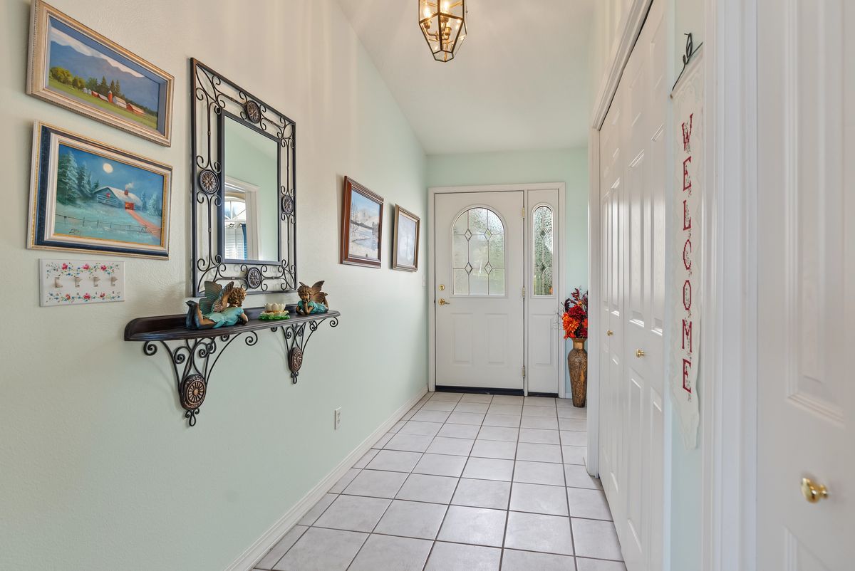 Tiled entry hall looking toward the front door