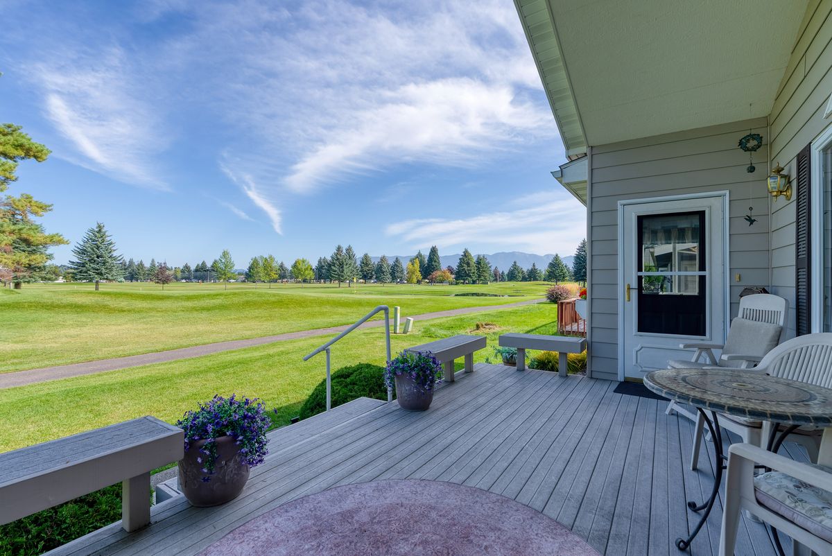 View from the back deck across the course, with a flag on the green