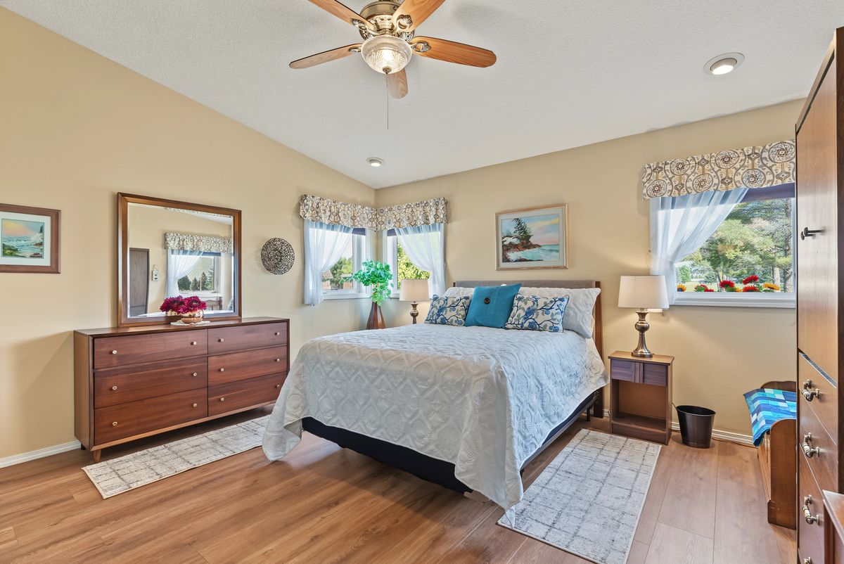 Bedroom with corner windows looking out to the golf course