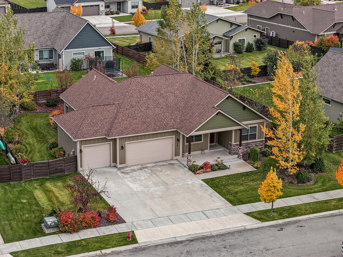 Aerial view of the home and three-car garage
