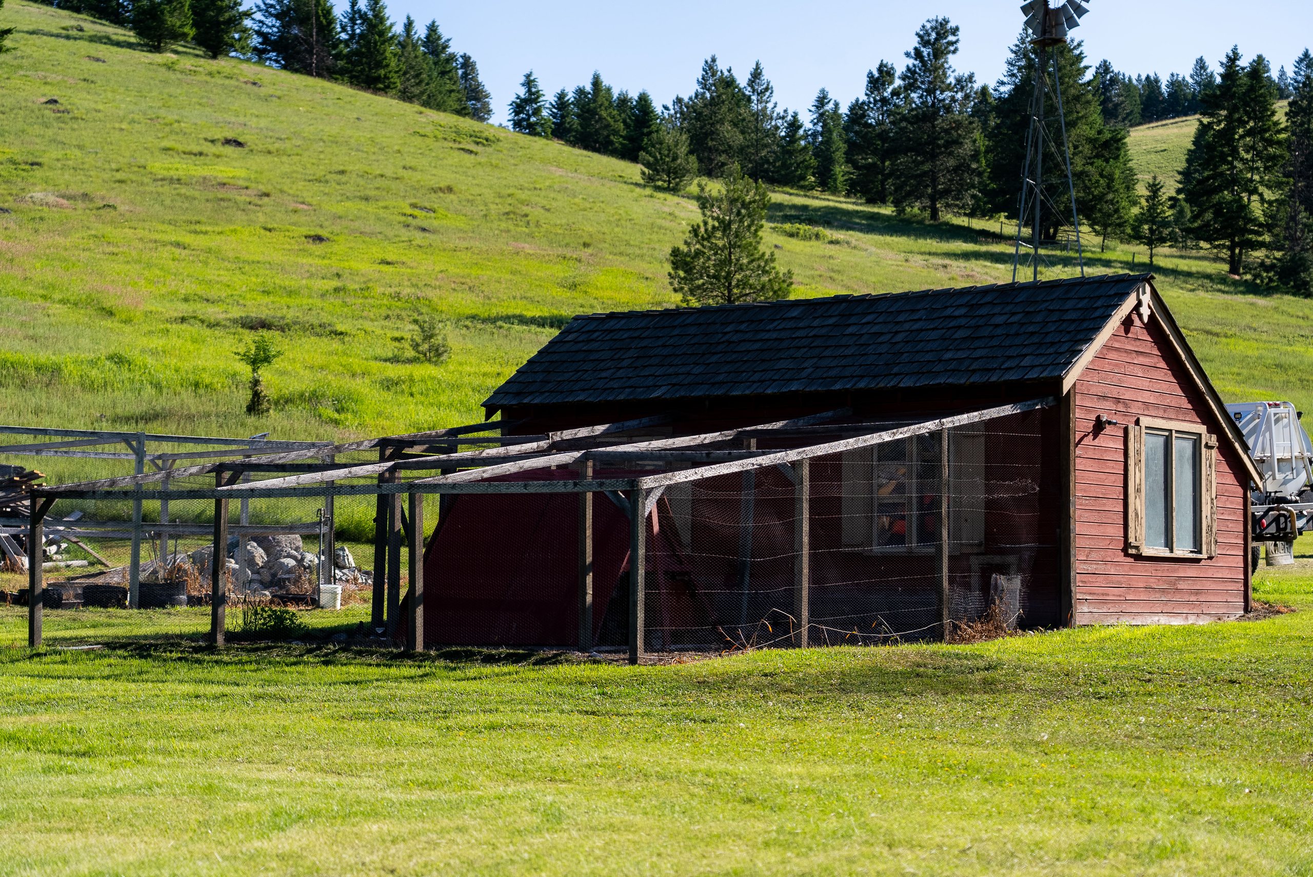 Outbuilding and corral fencing on the property